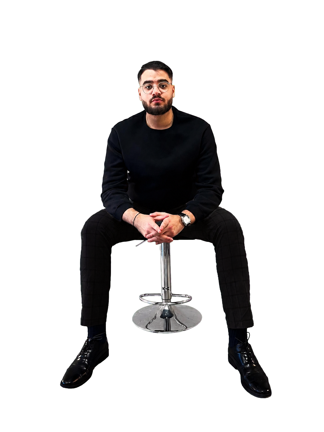 Kerolos Yousef seated in a studio portrait
